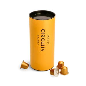 Canister of 30 Coffee Vittorio espresso pods displayed with coffee beans