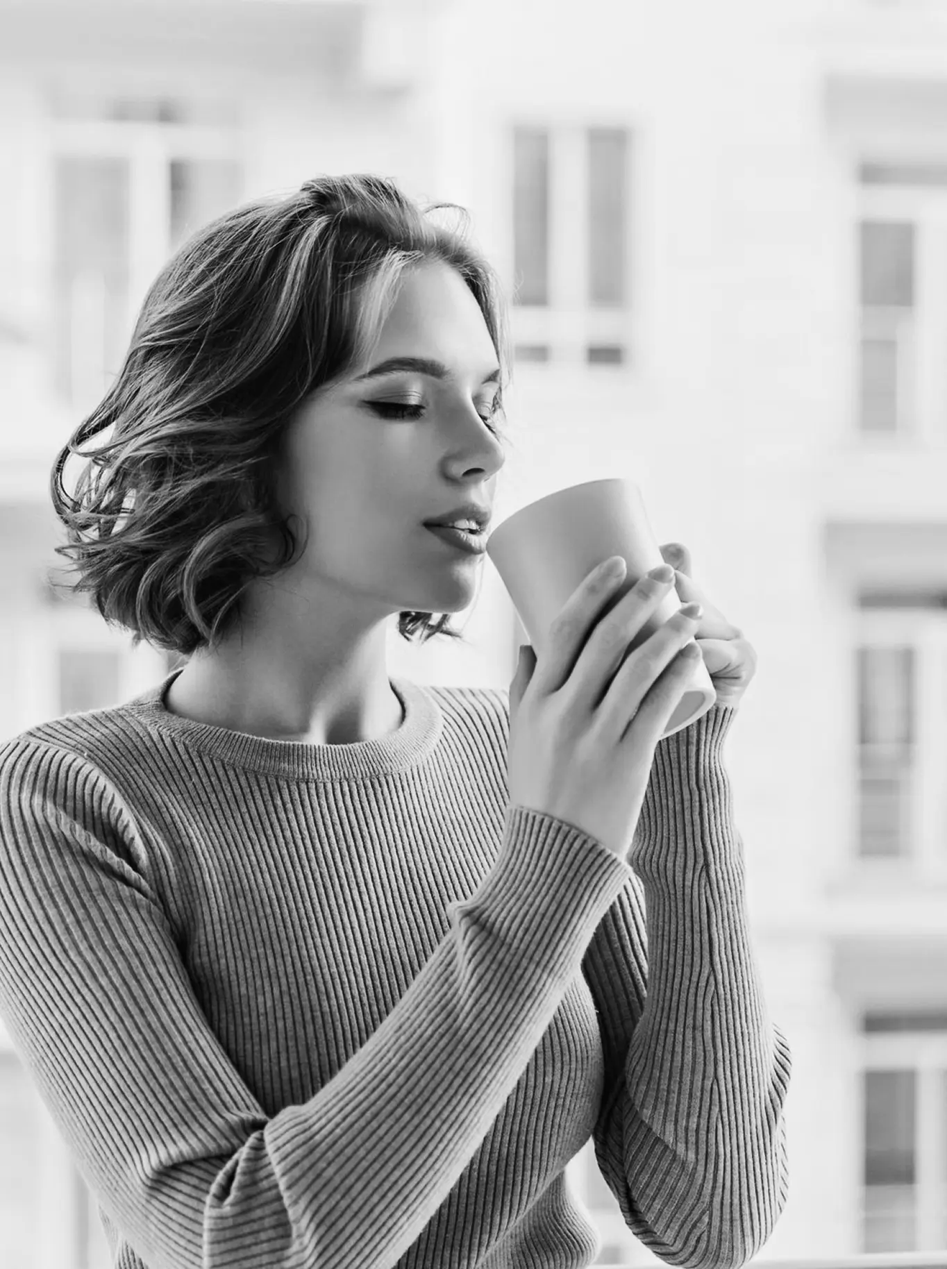 Coffee Vittorio espresso pod and cup with coffee crema in a cozy setting